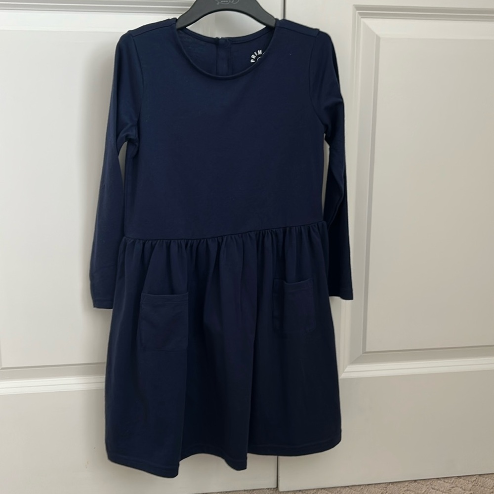 Primary long sleeve girls navy dress with front pockets. Size 6/7. Great shape
